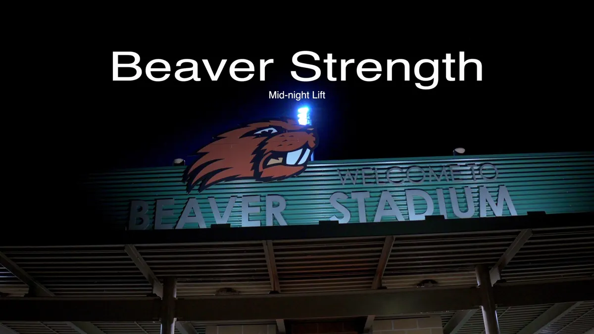Beaver Strength "Mid-night Lift" title over the lit Beaver Stadium sign at night